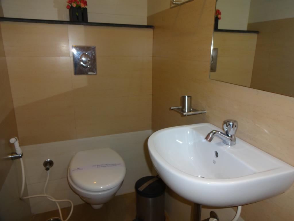 Hotel Sky Lite Коимбаторе Стая снимка