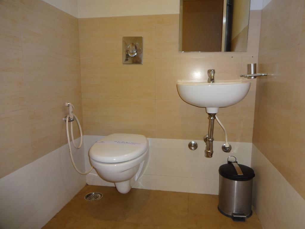 Hotel Sky Lite Коимбаторе Стая снимка